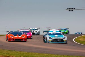 Extreme SuperCars charge through turn 1 at Zwartkops Raceway